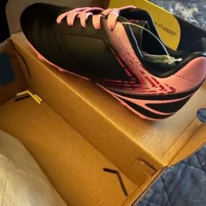 Brand new Toddler size 11 soccer shoes. Black with hot pink